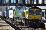 Class 66 leads container train though the station